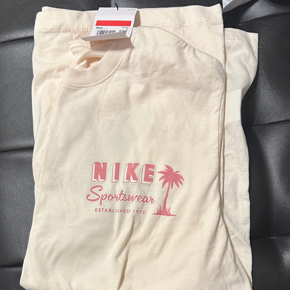Nike Beige Tee with Pink Graphic